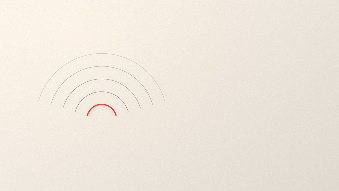 Concentric arcs spreading outward from a single point, the innermost arc picked out in red.