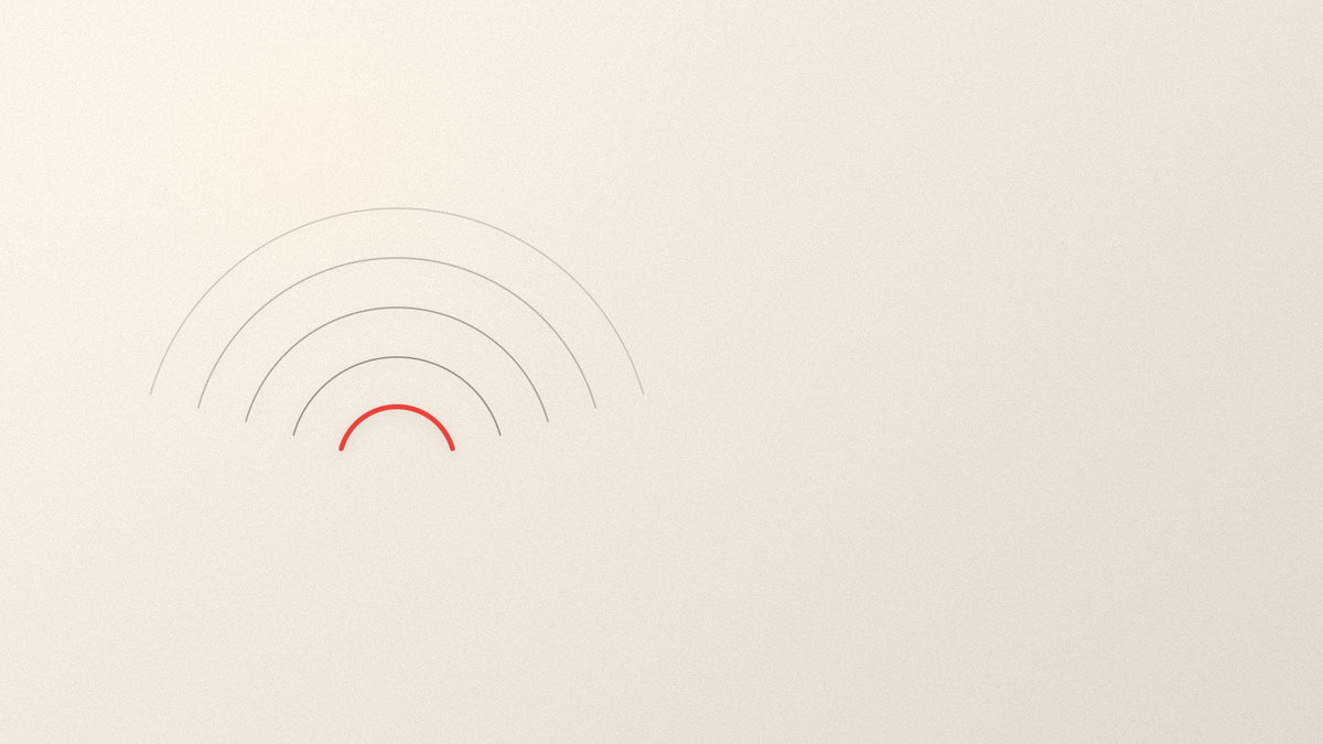 Concentric arcs spreading outward from a single point, the innermost arc picked out in red.